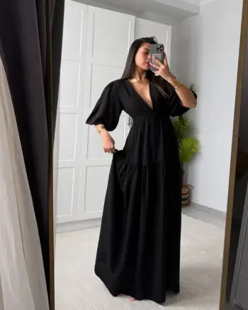 Fustan Elegant në Ngjyrë të Zezë: Klasike, Mister dhe Finesë në Çdo Detaj